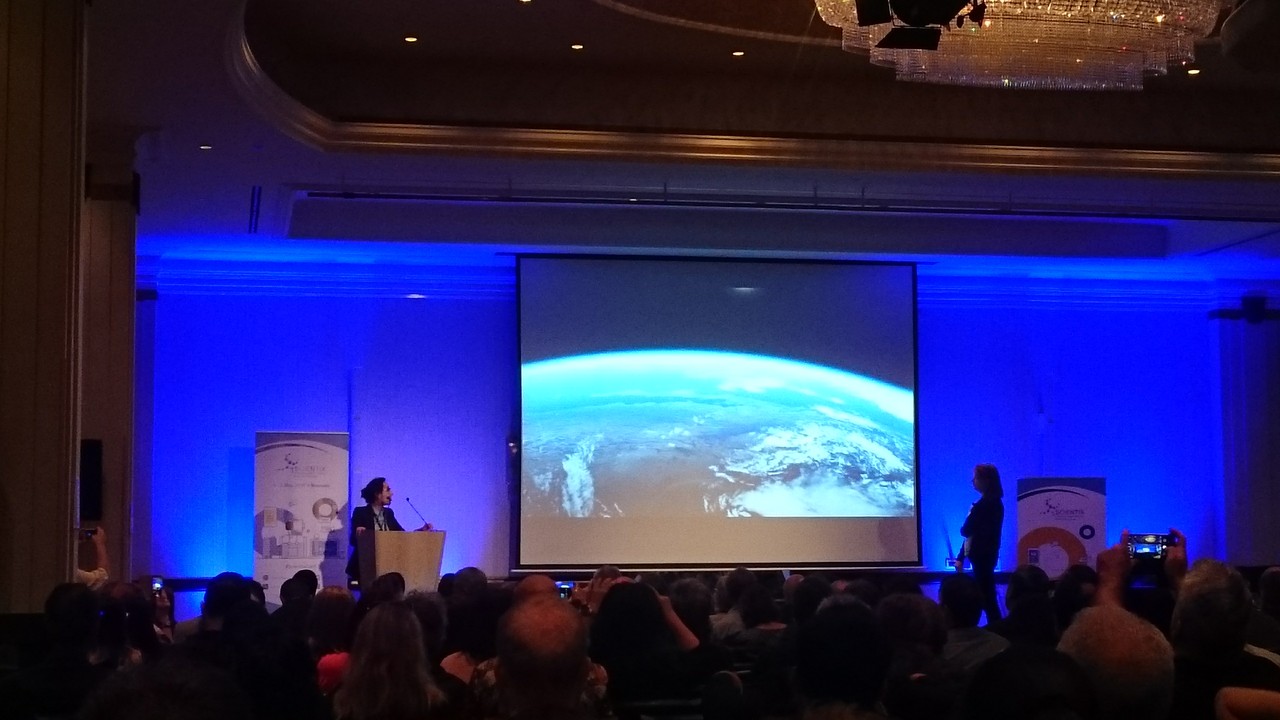 Mahbobah Ahmadi gives a presentation about the projects of the Astronomy & Society Group of Leiden University during the plenary session